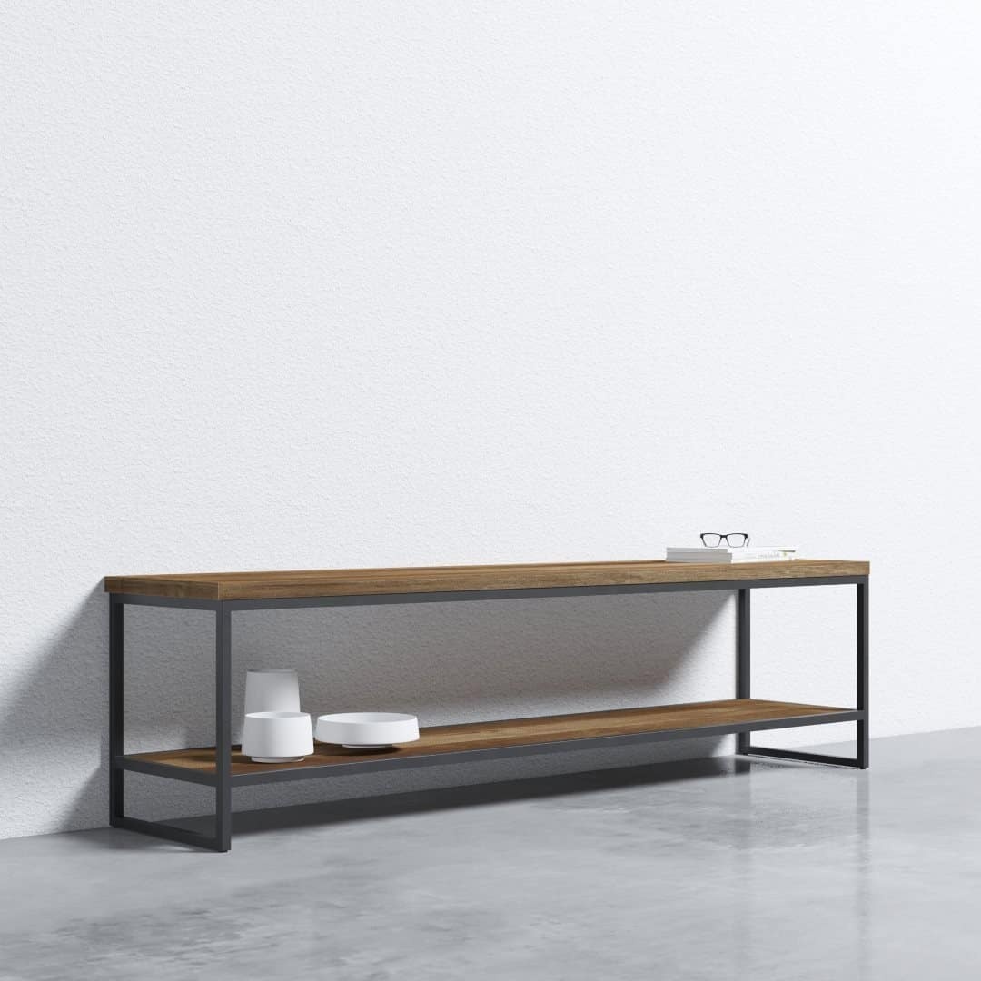 ADDITIONAL (3) METAL WORKS 2 SHELF CONSOLE - DTP-2019-004 Rev 01 (TV Meubel Beam Large 180 x 40 x 50) ( Gamker ) b A minimalist console table made of wood and metal against a plain white wall. Objects on the table include a pair of glasses, a tray with small items, and two white geometric containers.