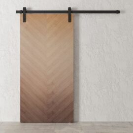 The Havana Walnut Barn Door (83" x 40") features a beautiful chevron pattern and is mounted on a sleek black metal rail, perfectly complementing the textured white wall.