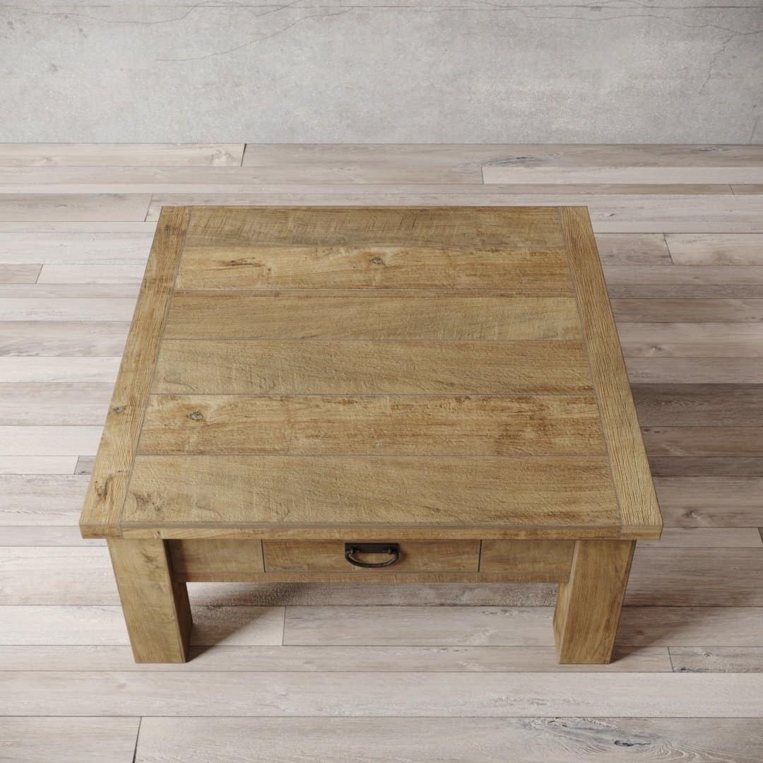 Urban Woodcraft 40 Riverbend Coffee Table - Natural (2) The Riverbend Coffee Table, with its natural wood finish and single drawer adorned with a metal handle, sits elegantly on the light wood floor.