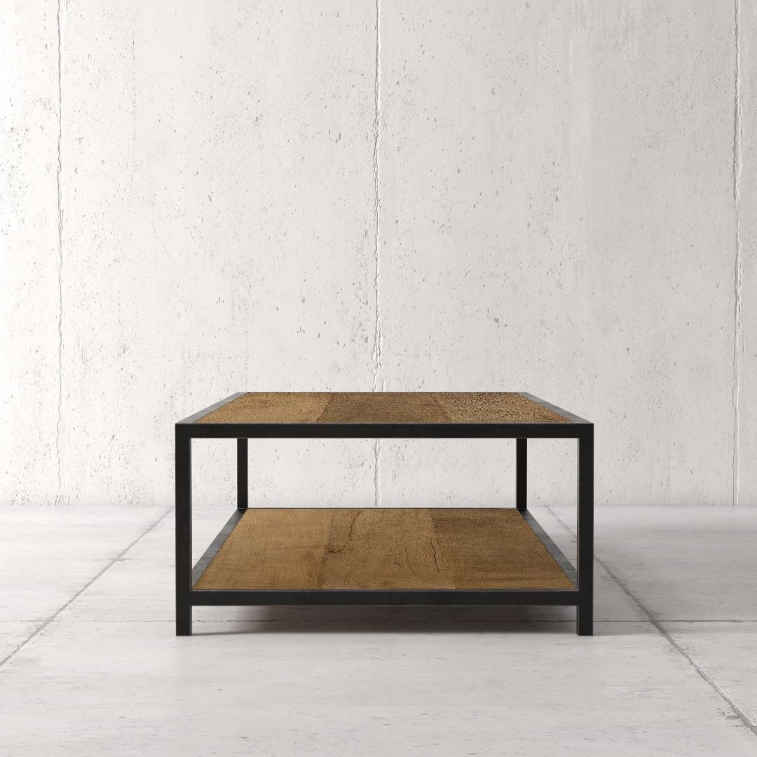 Urban Woodcraft 51_ Opus Coffee Table 4 The Opus Coffee Table, featuring a minimalist design with a metal frame and wooden top and lower shelf, is placed on a light gray tile floor against a plain white wall.