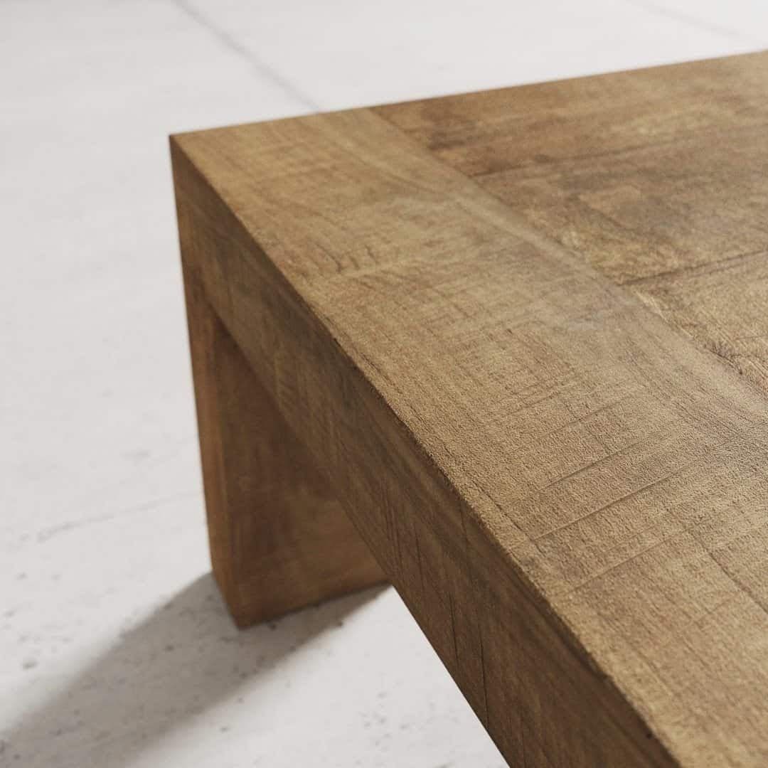 Urban Woodcraft 55 Madison Coffee Table - Natural (4) Close-up view of the corner of the Madison Coffee Table, showcasing its smooth, natural wooden finish.