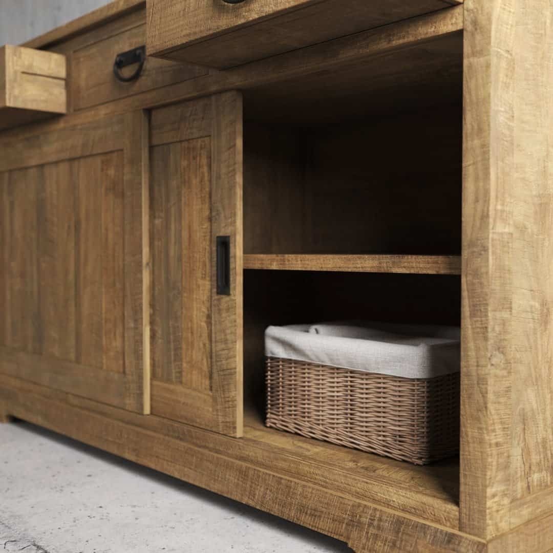 Urban Woodcraft 65 Riverbend Dining Buffet - Natural (6) The Riverbend Sliding Door Dining Buffet features two sliding doors, a drawer, and an open shelf complete with a wicker basket lined with fabric. Boasting a rustic appearance, it stands gracefully on a concrete floor.