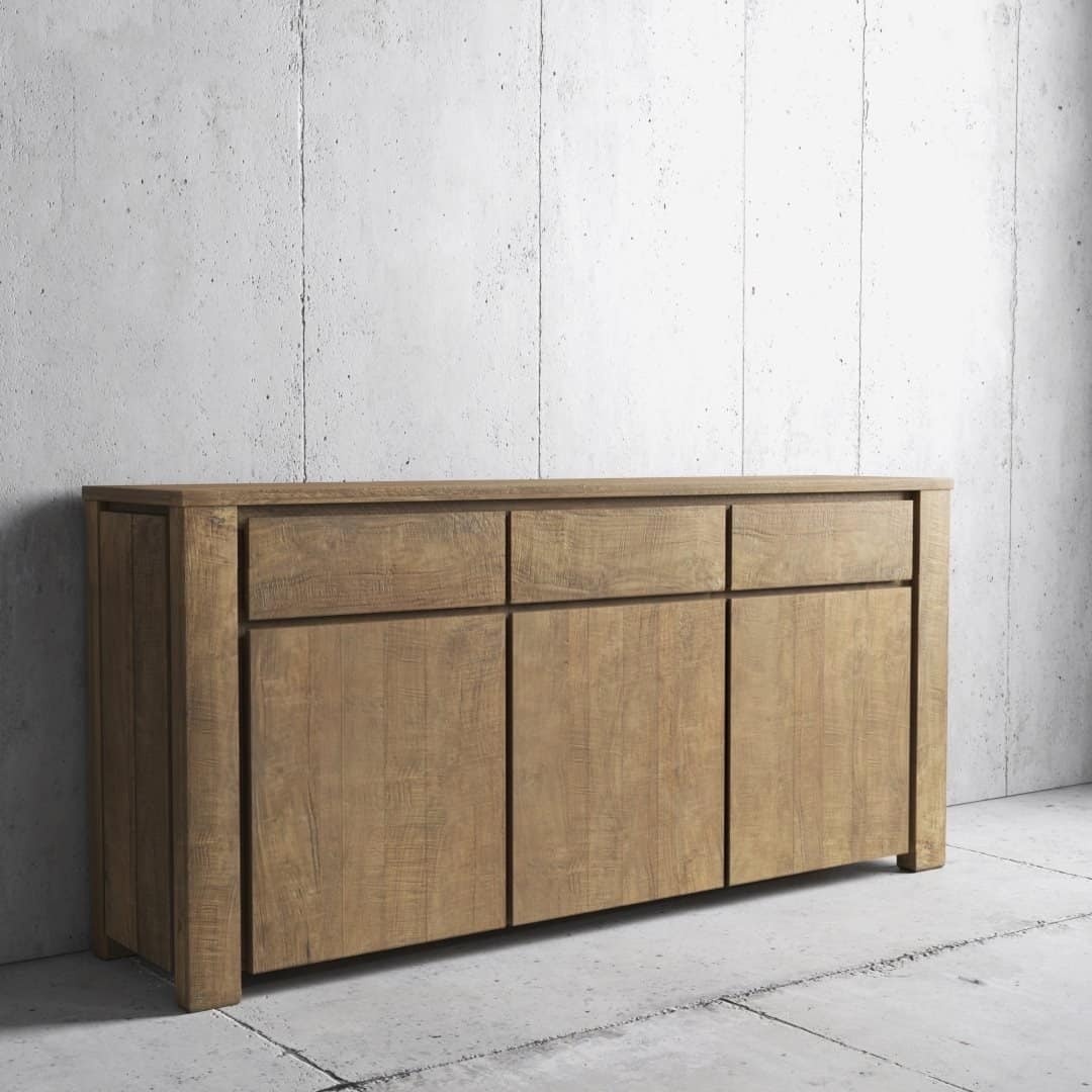 Urban Woodcraft 75 Teca Dining Buffet - Natural (3) A Teca Dining Buffet with three drawers on the upper row and three doors beneath, positioned against a plain concrete wall.