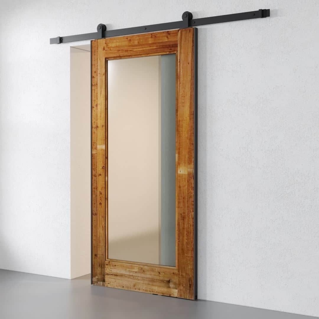 1-Panel-Barn-Door-Reclaimed-Wood_02_1080x1080 The 1-Panel, Reclaimed Wood Barn Door (83" x 40") with a large glass panel is mounted on a black metal track against a white wall.