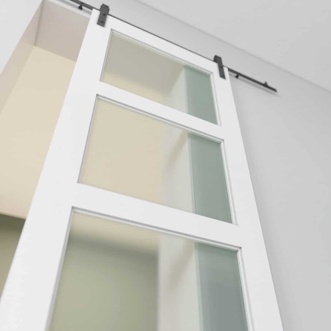 3 Panel Glass - White (3) An 83" x 40" white barn door with 3 frosted glass panels is installed on a black track in a modern interior space.