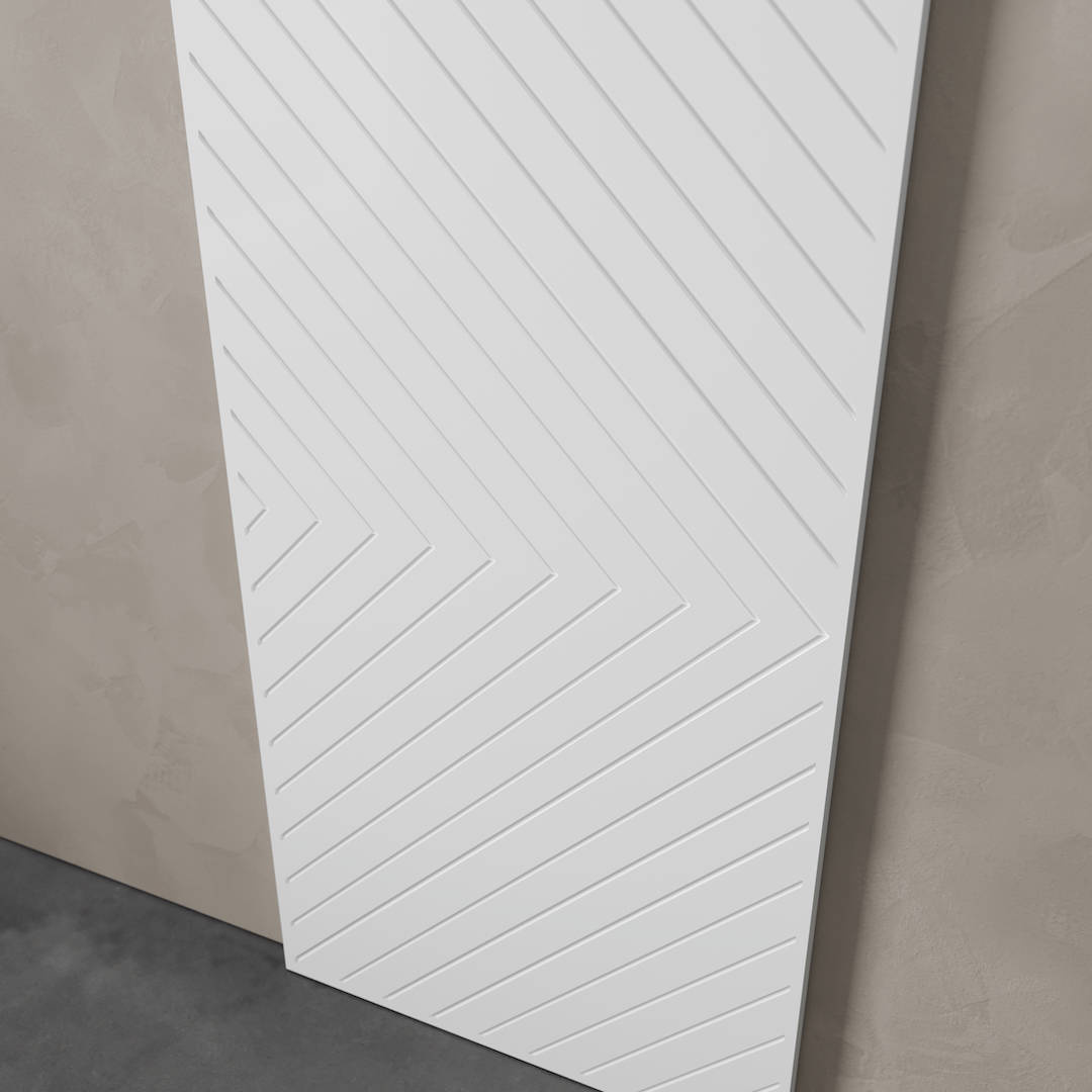 Urban Woodcraft Venice 40in Arrow Barn Door White 3 The Venice White Barn Door (83" x 40") features a modern diagonal striped pattern and is seen leaning against a beige wall.