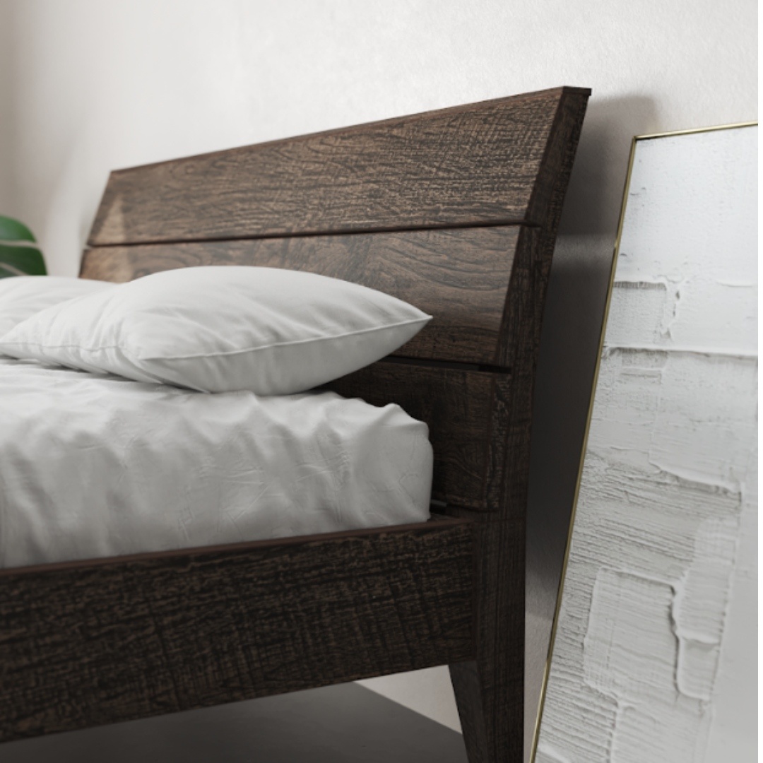 Tuscan Bed Cafe Noire King _ Queen - 3 The Tuscan Bed (Café Noire) with a white mattress and pillows sits next to a wall, where a large framed abstract artwork is leaning.
