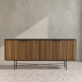 The Osaka Dining Buffet, featuring vertical grooves and a black top, stands against a plain, light-colored wall on a terrazzo floor.