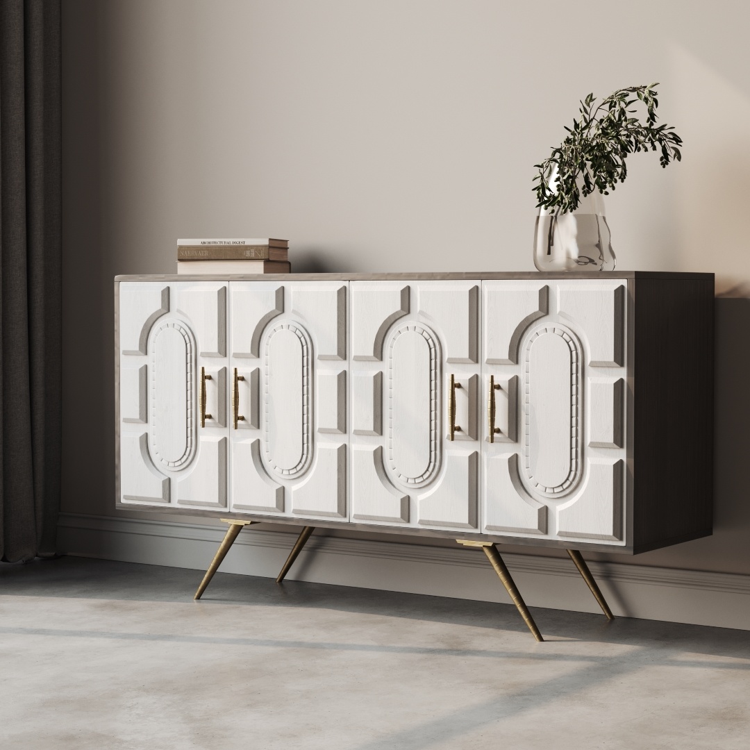 Lugo 60 Side Cabinet-e The Lugo 60" Sideboard in white, featuring modern geometric patterns, stands against the wall. It boasts gold legs and handles, with two books and a glass vase filled with greenery adorning the top. A shadow is cast on the floor.