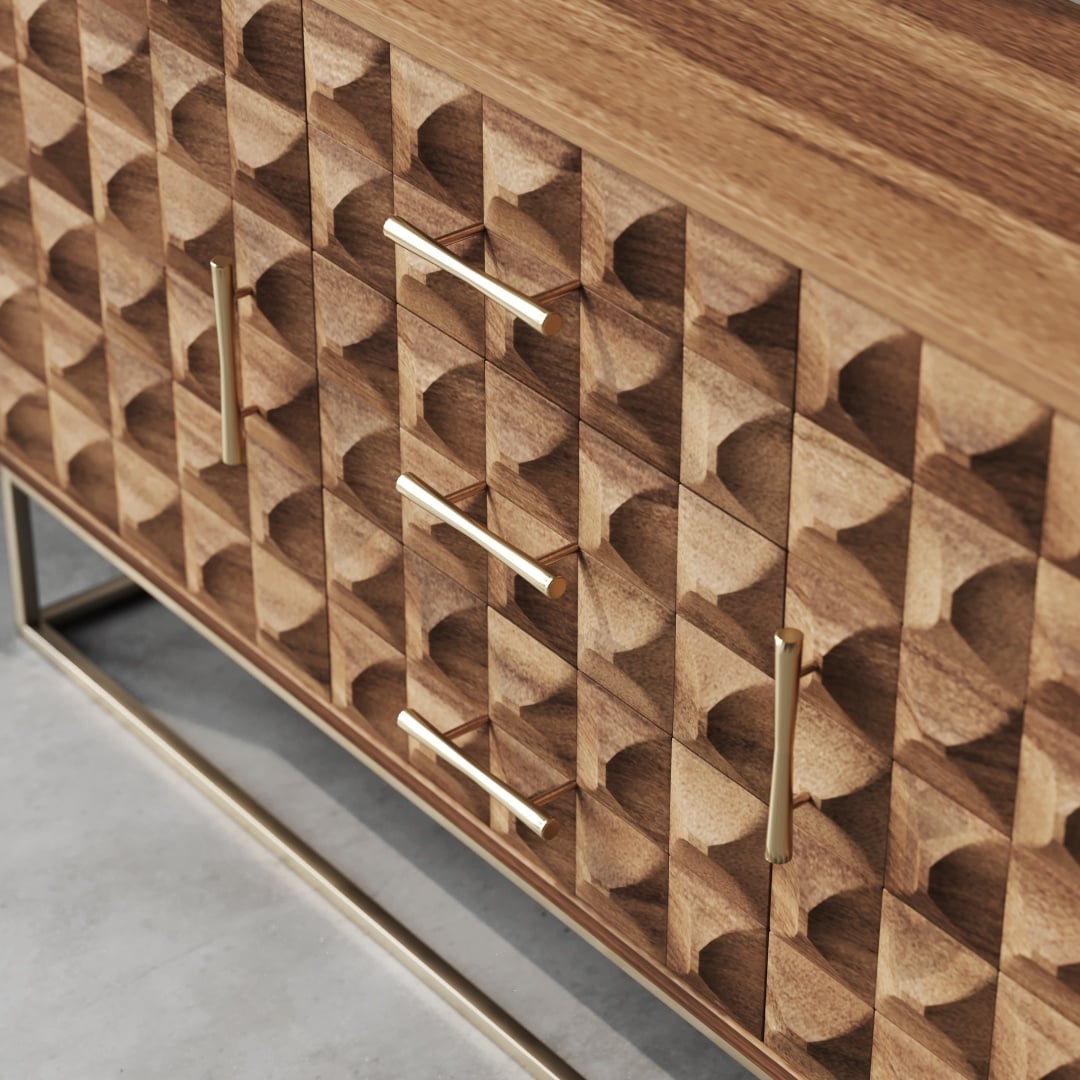 Wadi 57 Side Cabinet-e Close-up of the Wadi 58" Sideboard, showcasing a geometric carved pattern on its wooden surface with three brass handles and a minimalist metal base.