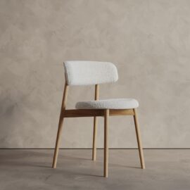 The Alto 20" Dining Chair (Wood) features a modern wooden frame and legs, with a white upholstered seat and backrest, showcased against a light textured wall and floor.
