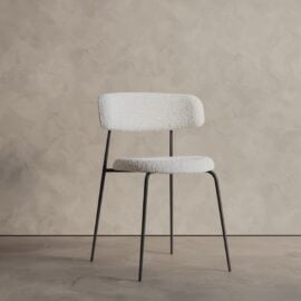 The Alto 20" Dining Chair (Metal) features a white textured seat and backrest with slim black metal legs, shown against a beige textured wall and floor.