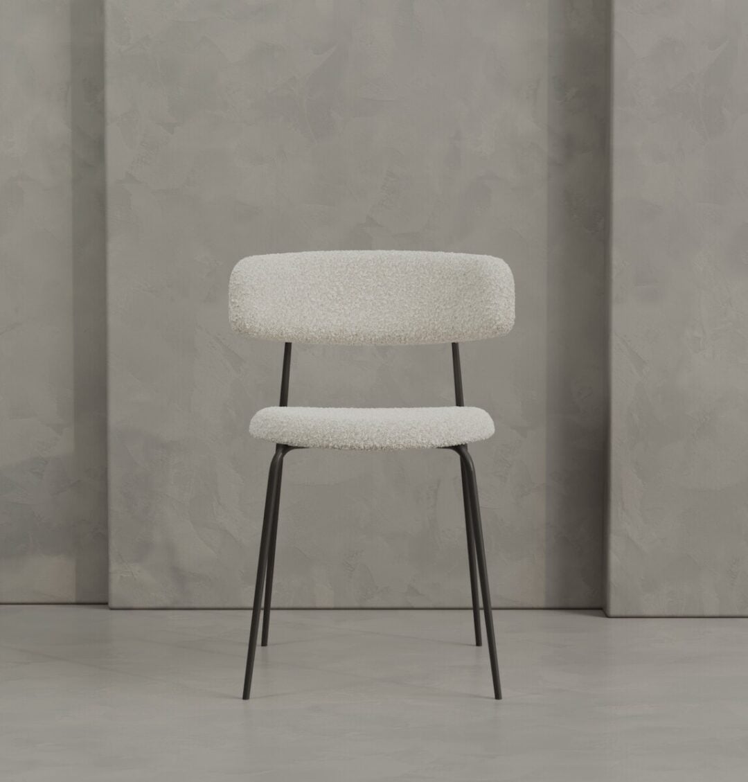 2 Alto Metal METAL The Alto 20" Dining Chair (Metal) features a white upholstered seat and backrest with slim black metal legs, set against a gray textured wall.