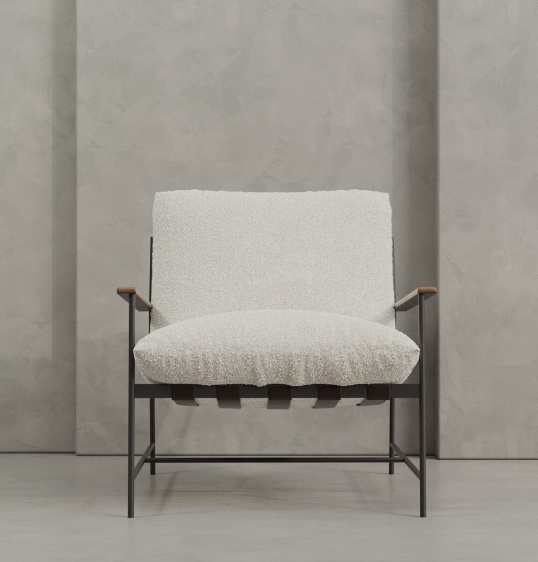 3 Aspen The Aspen 30" Lounge Chair features white textured upholstery, a sleek metal frame, wooden armrests, and a minimalist silhouette, styled here against a gray textured wall.
