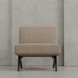 The Laurel 27" Lounge Chair features beige upholstery, no arms, and black legs, set against a textured light gray wall.