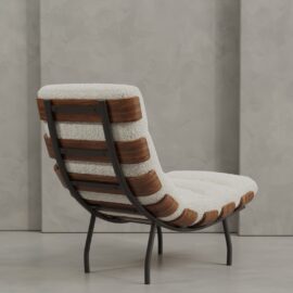 The Oslo 24" Lounge Chair features a black metal frame, curved wooden supports, and white cushioned upholstery, set on a light gray floor with a textured gray wall backdrop.