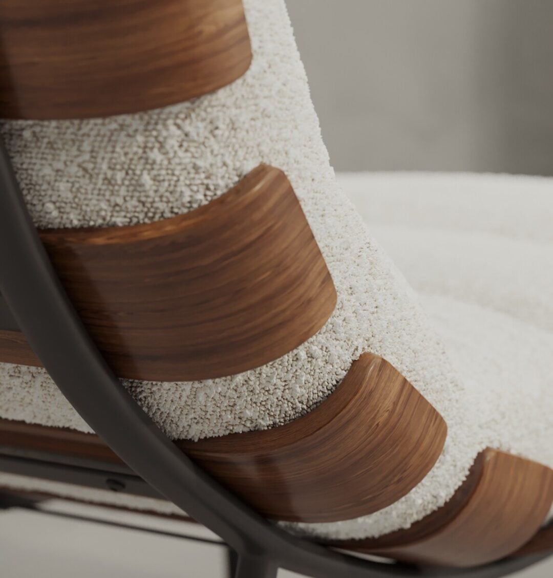 5 OSLO Close-up of the Oslo 24" Lounge Chair with curved wooden slats, textured cream upholstery, and a metal frame on the side.