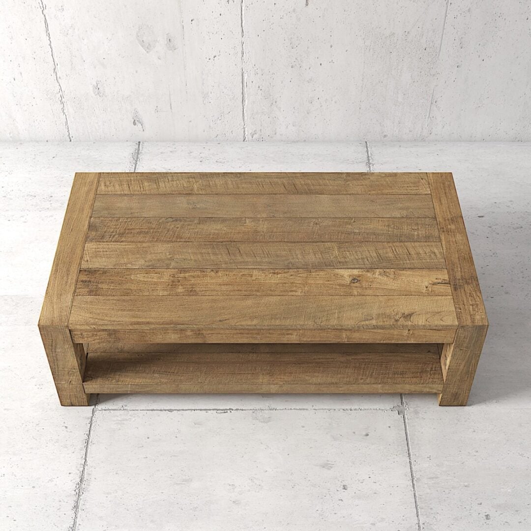 Villa Coffee Table 60 03 Rectangular wooden coffee table with a simple, rustic design, featuring a lower shelf for storage, set against a light-colored tiled floor and wall.