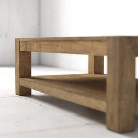 A wooden coffee table with a lower shelf stands on a white tiled floor against a plain white wall in a minimalist room.