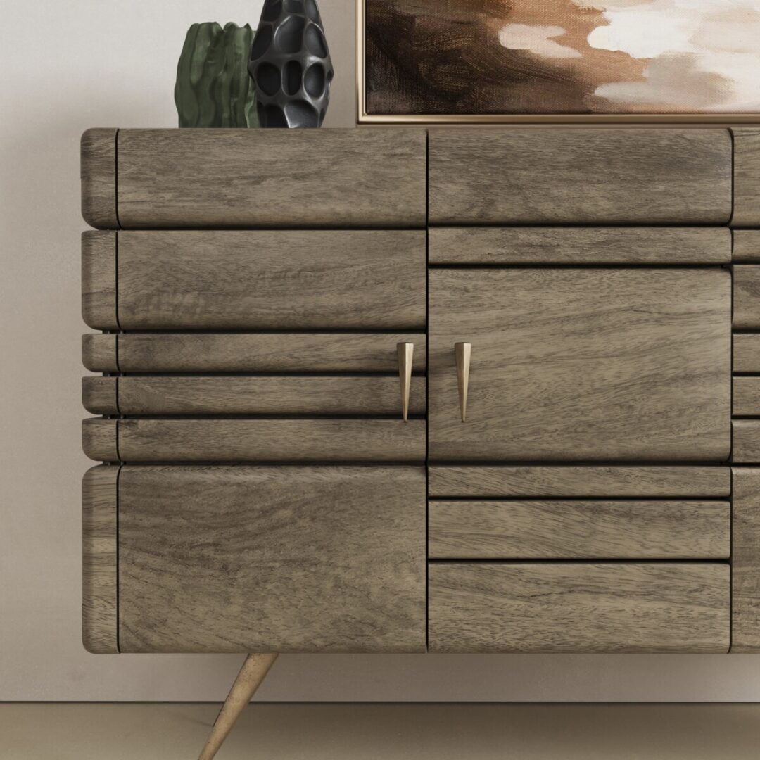 Kava 60-in Sideboard-02 A close-up of the Kava Sideboard, featuring gold handles, angled legs, and decorative ceramic objects placed on top.