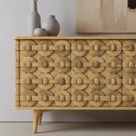The Kinta Sideboard is a wooden cabinet featuring a decorative pattern.