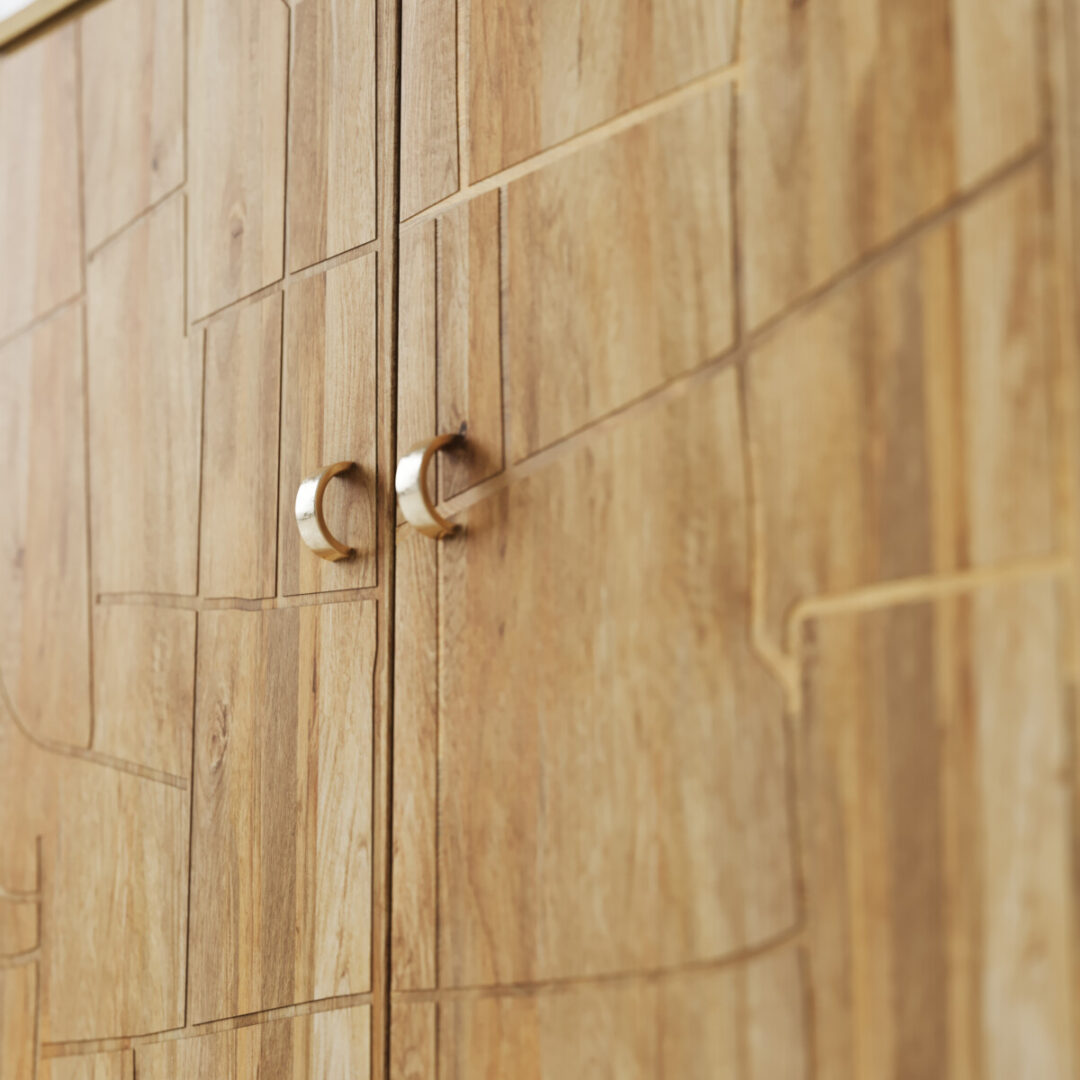 Noka 60-in. Sideboard-04 Close-up of the Noka Sideboardโs wooden cabinet doors showcasing natural grain and two metallic handles.
