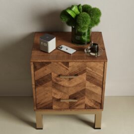 The Zera Sideboard holds a smart clock, a smartphone, a glass of espresso on a saucer, and a vase with green flowers.