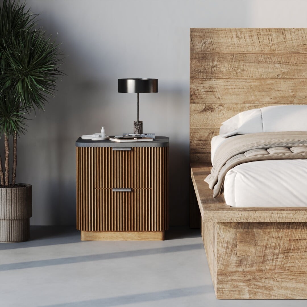 Montara Bed+Nightstand-2 A Montara Bed with a wooden frame stands beside a wooden nightstand with two drawers, topped with a lamp, book, and tissues, while a potted plant is positioned nearby.