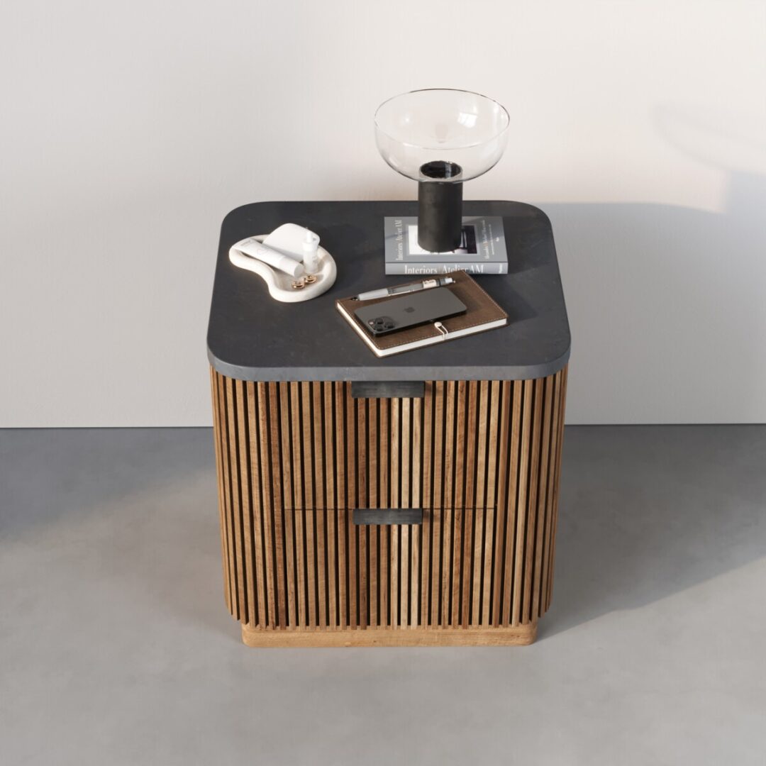 Osaka Nightstand The Osaka Nightstand features two drawers and a sleek black tabletop, with a lamp, phone, notepad, and decorative accents neatly arranged on top.